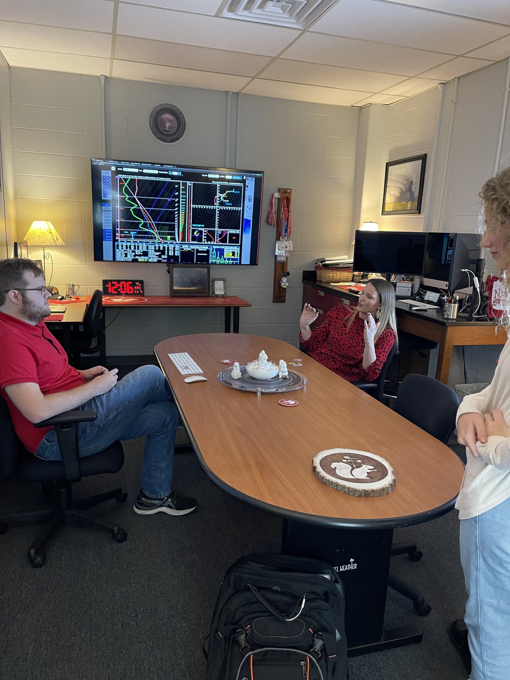 Students talking through a Skew-T sounding on the CHAOS lab display