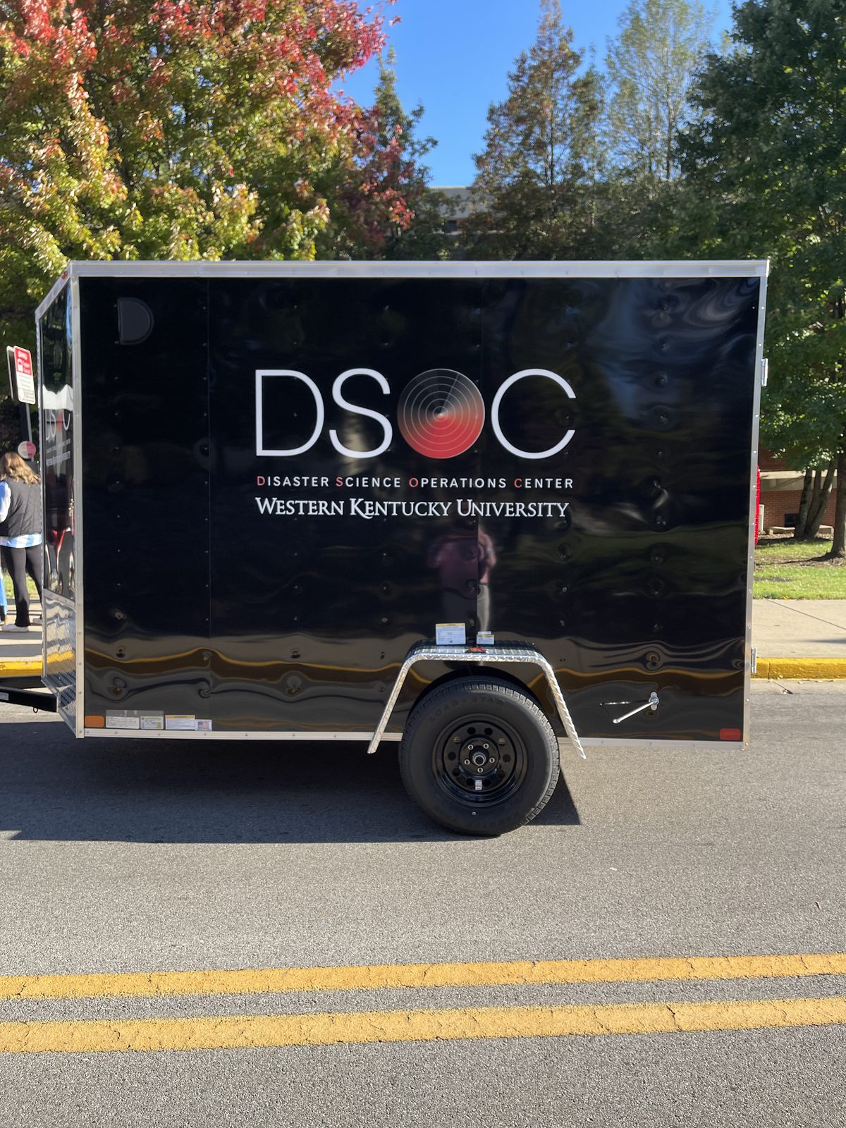The DSOC Mobile Weather Operations Unit, a black DSOC-branded trailer parked on campus